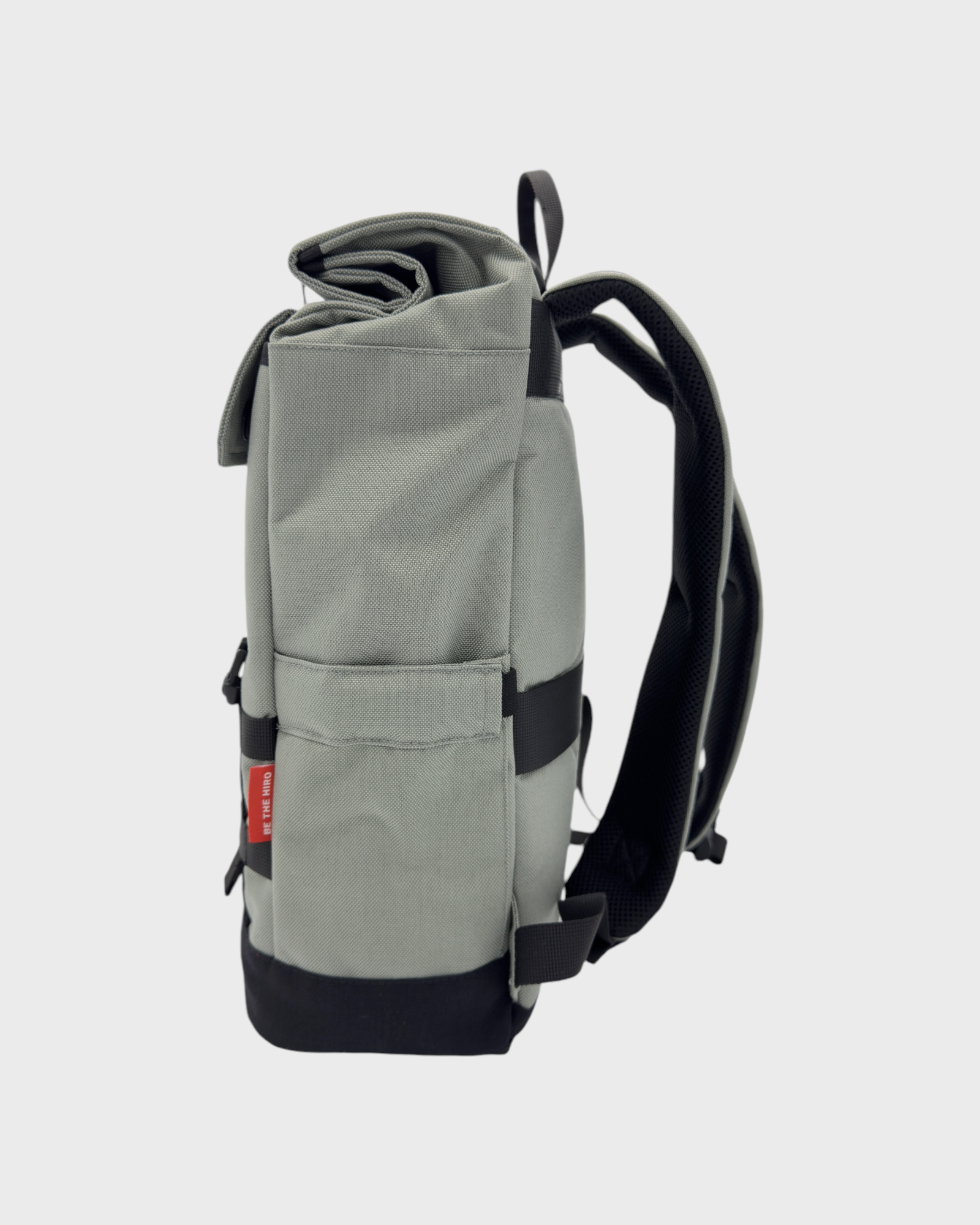 Silver Minato Lite backpack side view showcasing adjustable design and compact size for everyday practicality and versatility.